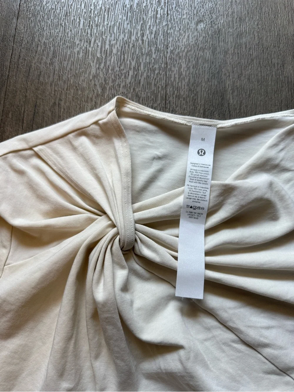 Lululemon asymmetric front-twist top in cream/bone color  Size M
